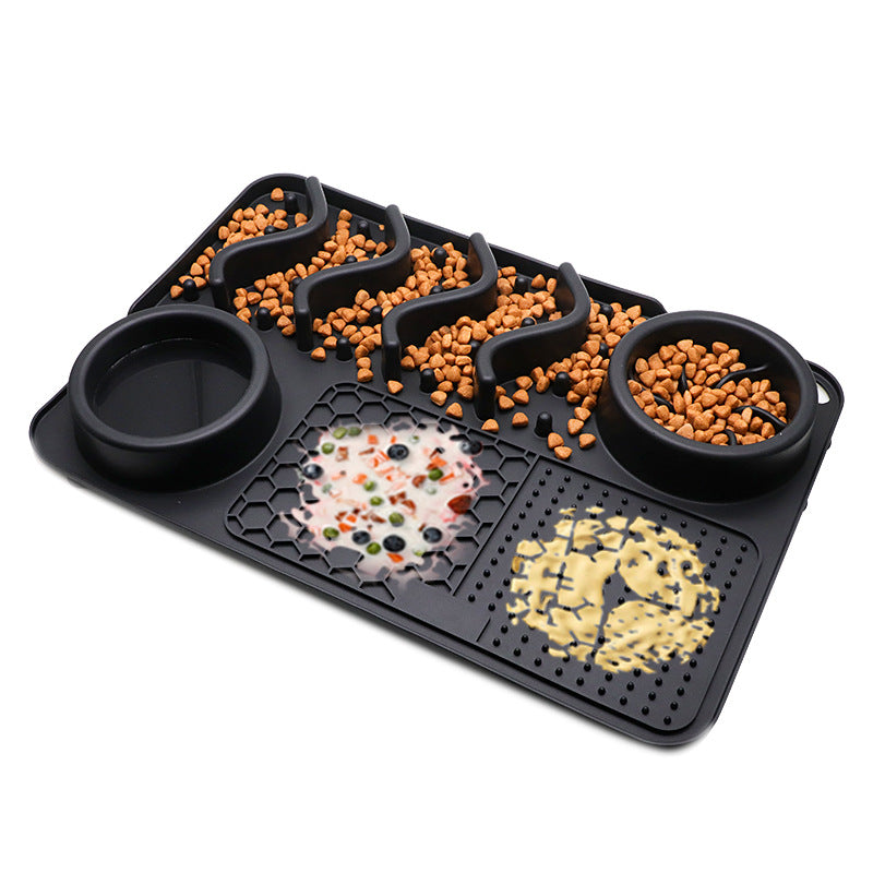 Black silicone dog slow feeder mat with raised ridges, water bowl, and licking pad compartments