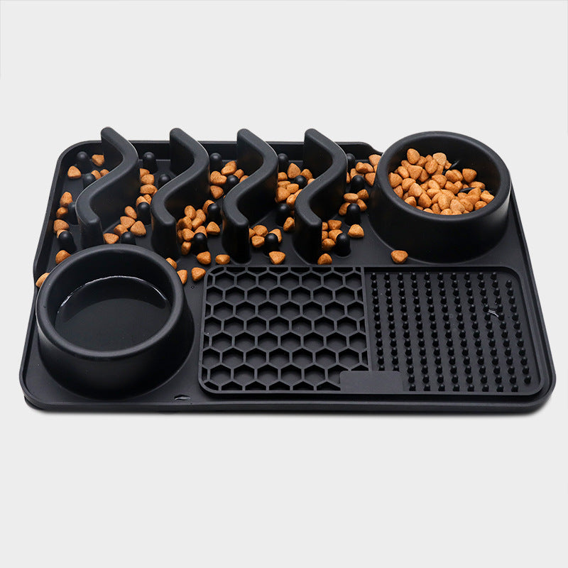 Black silicone dog slow feeder mat with raised ridges, water bowl, and licking pad compartments