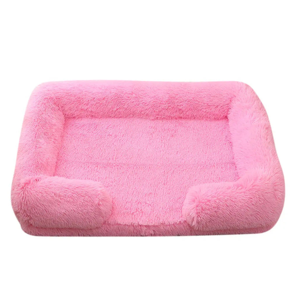 Pink calming pet bed with raised edges for extra comfort