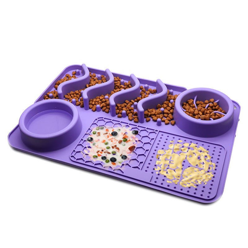 Purple silicone dog slow feeder mat with raised ridges, water bowl, and licking pad compartments