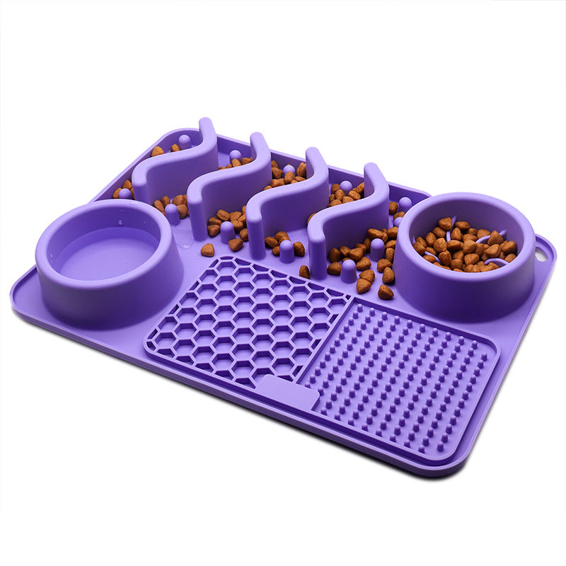 Purple small silicone dog slow feeder mat with raised ridges, water bowl, and licking pad compartments