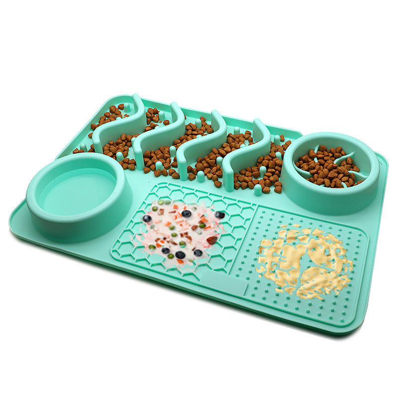 Teal silicone dog slow feeder mat with raised ridges, water bowl, and licking pad compartments