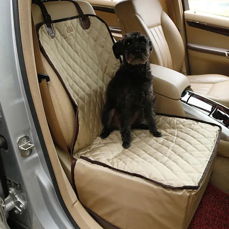 Dog sitting on a beige car seat cover in a vehicle