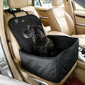 Black dog sitting in a waterproof front seat dog car seat cover with quilted padding and raised bolster sides